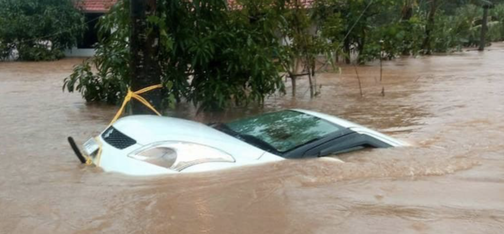 "Flood-damaged vehicle inspection in Kerala used car market"